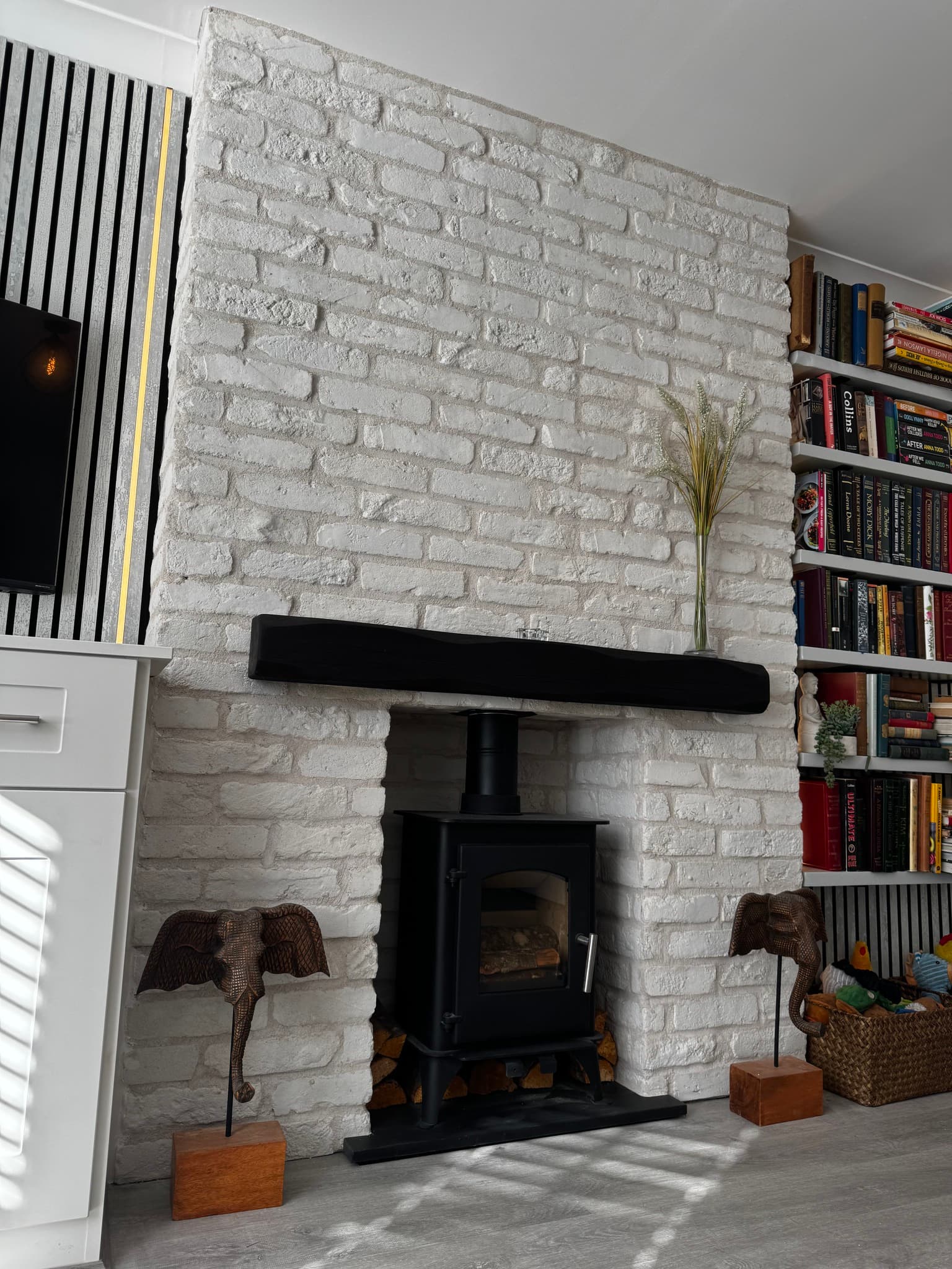 Feature chimney breast with white brick-effect tiles